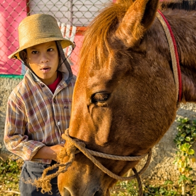 Young boy on the outskirts of town was happy to bring his horse in and stop for us to photograph.